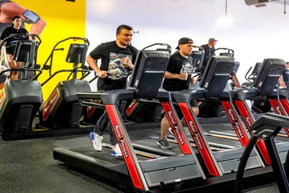 Retro Fitness members participating in Zone 2 cardio on treadmills